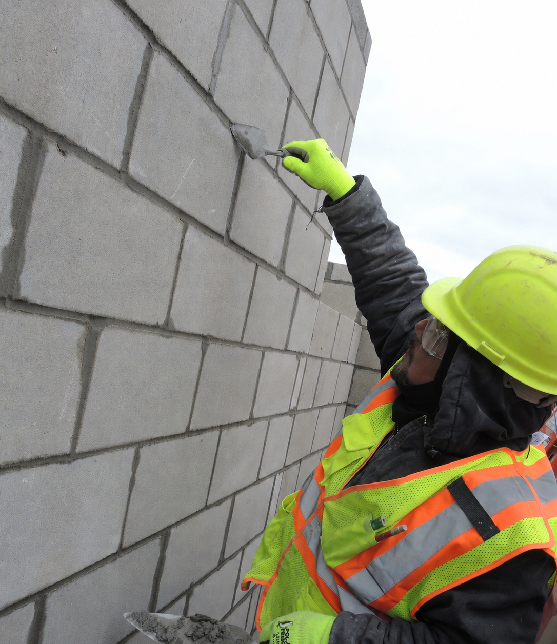 man smoothing joints with a pointing trowel